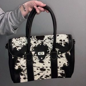 Black and white purse with leather